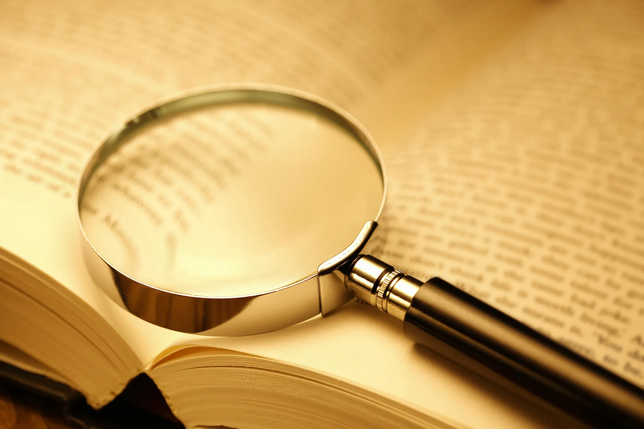 Magnifying glass on an open book