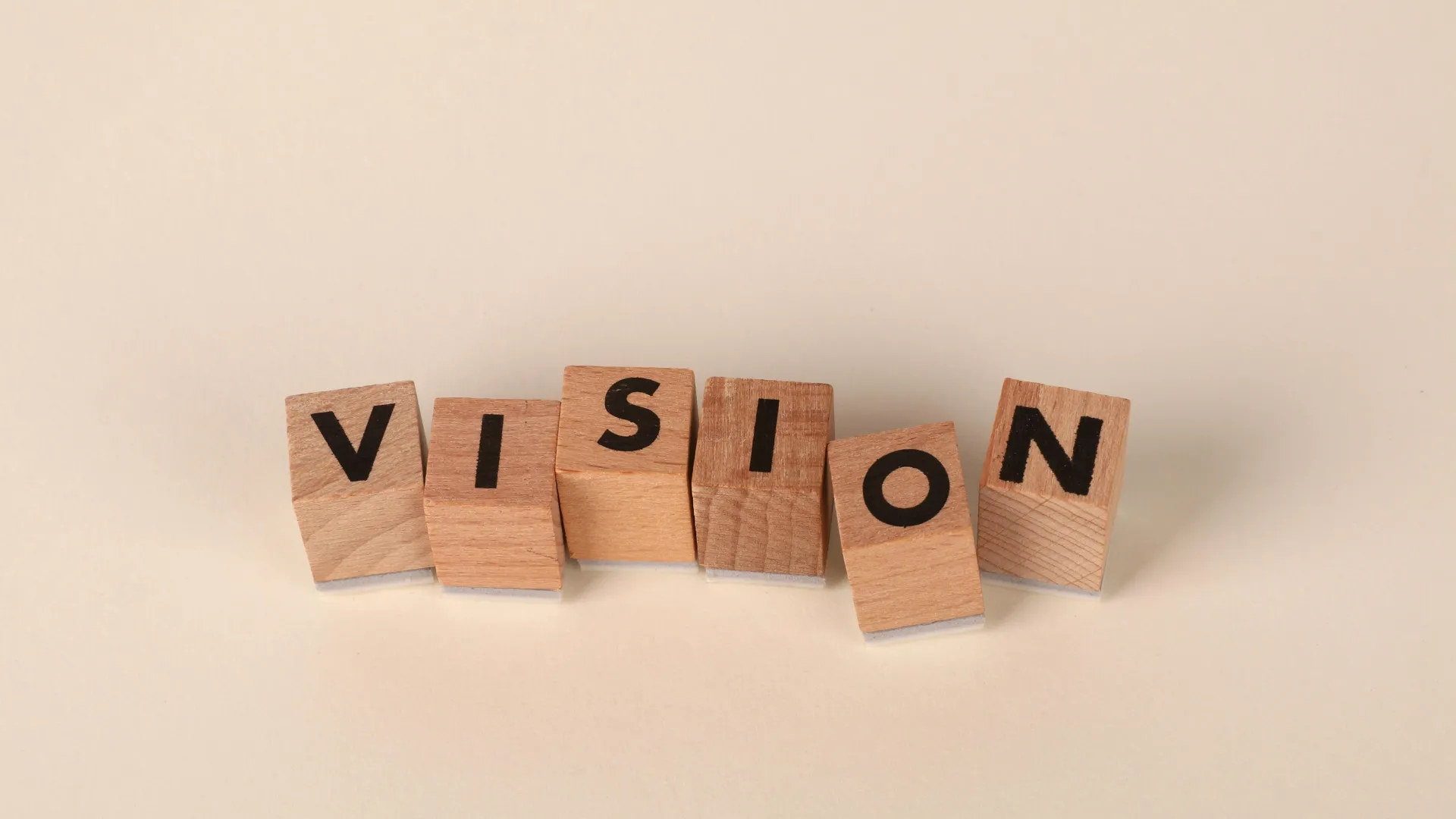 Wooden blocks spelling the word "VISION"