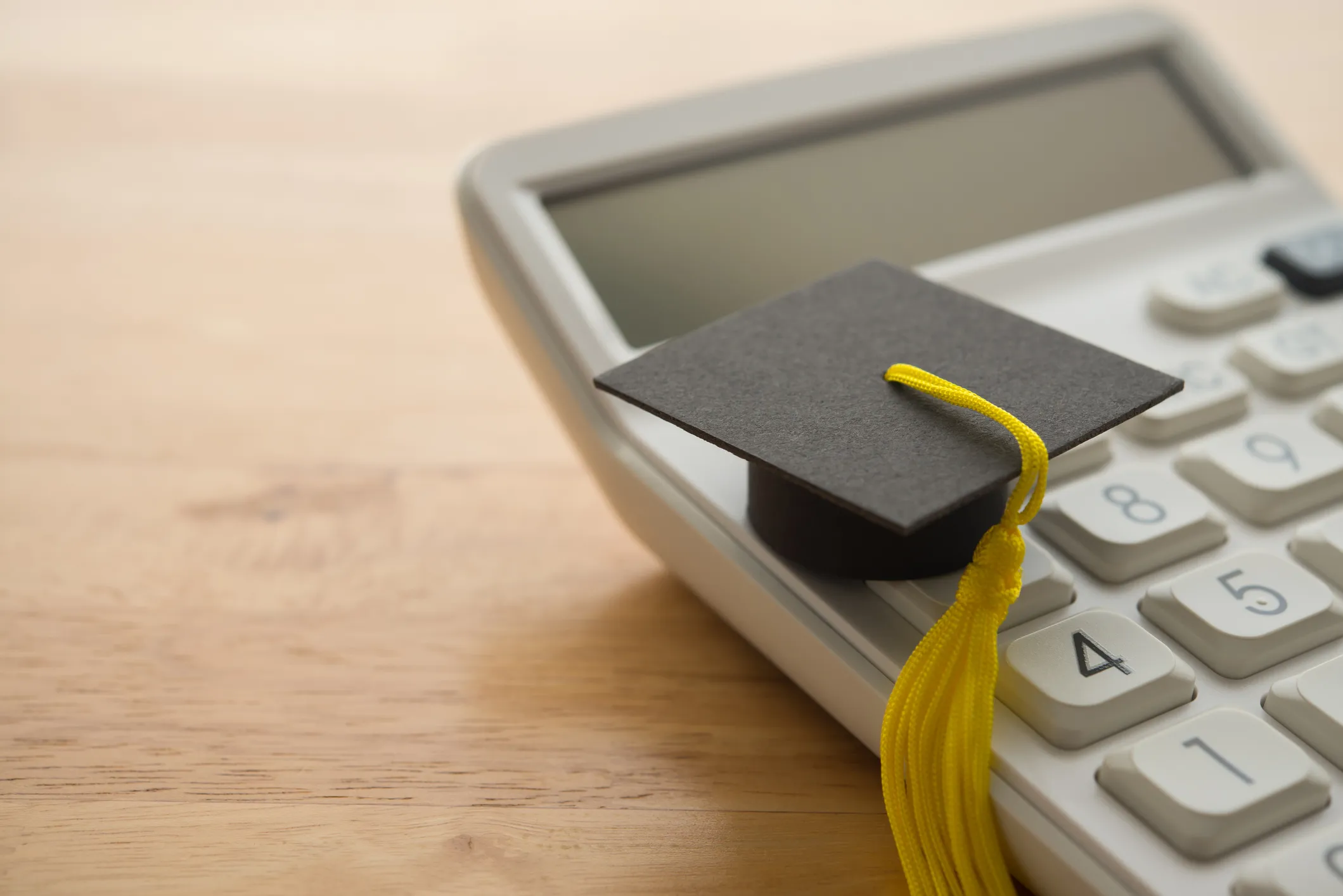 Calculator with a graduation cap on top
