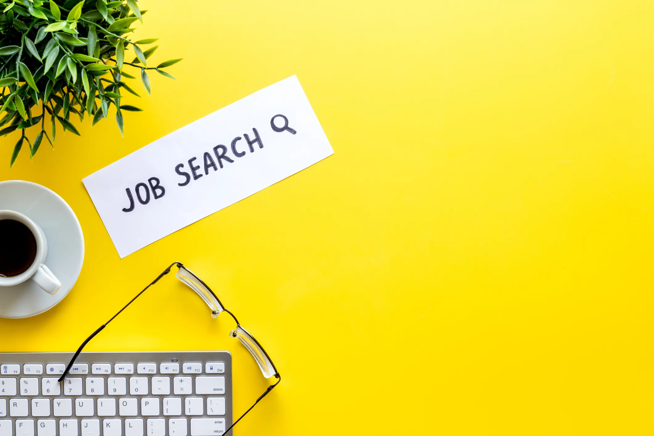 A paper reading 'JOB SEARCH' and a magnifying glass icon