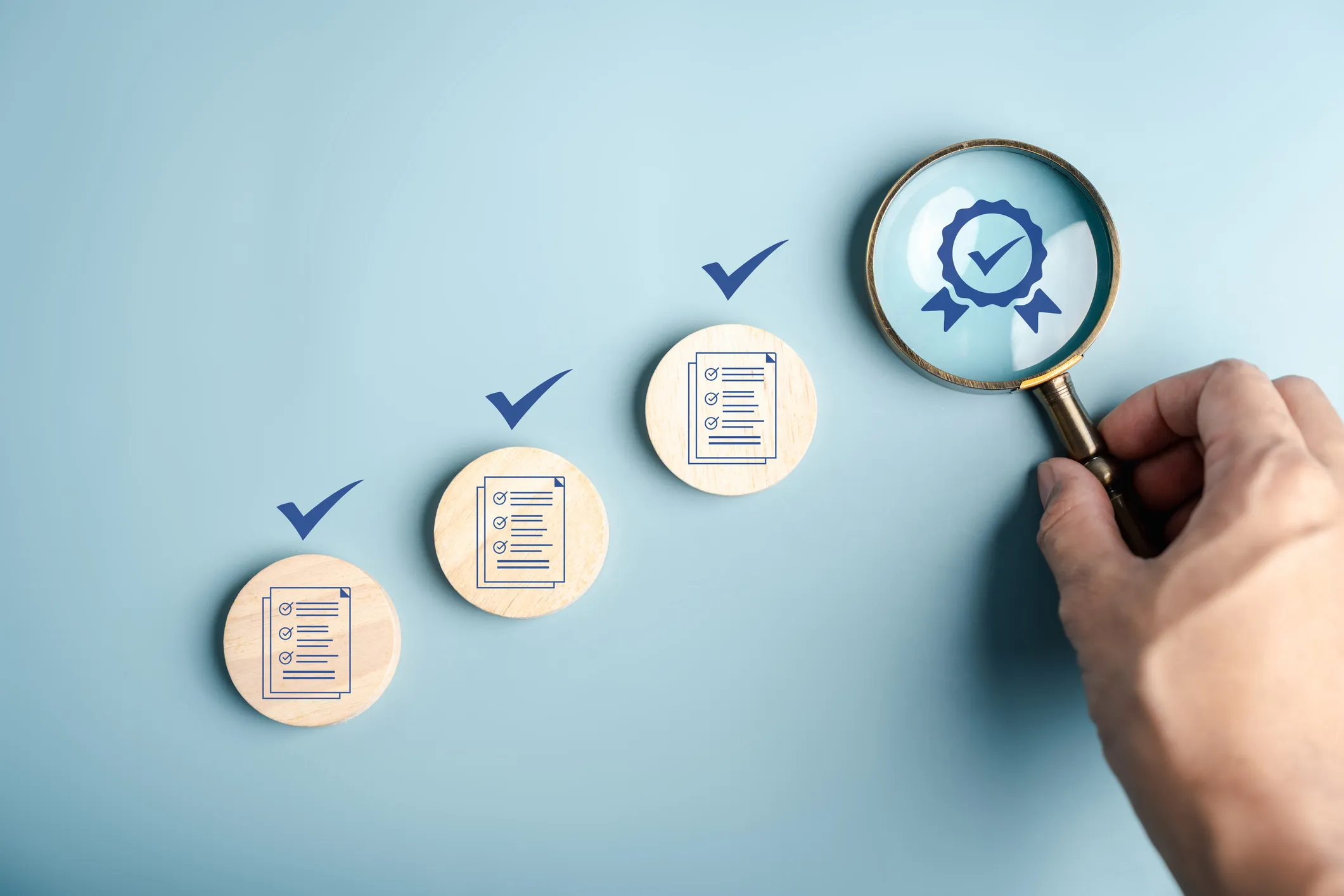 Three checklist icons with check marks and a magnifying glass highlighting a certification badge.