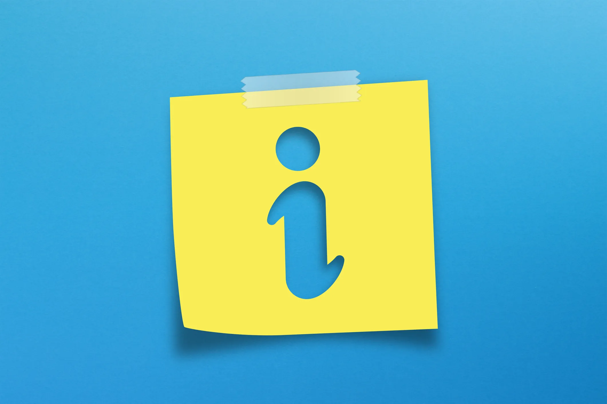 Note paper and information sign on blue background